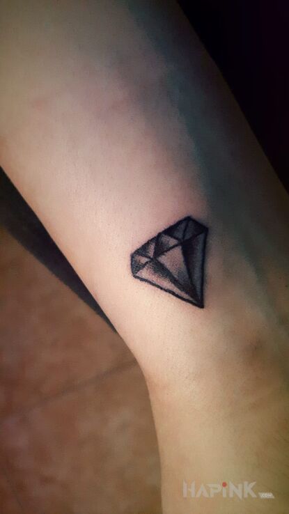 Tattoo Diamond in objects motif on the wrist