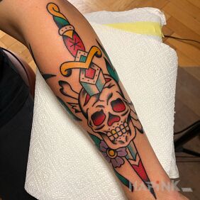 Tattoo Skull / Dagger / Bones / Flowers on the forearm motif: objects style: oldschool