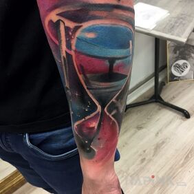 Tattoo Abstract hourglass, space on the forearm motif: colorful