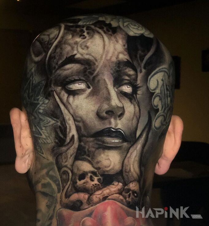 Tattoo Kobieta demon in faces motif and realistic style on the head