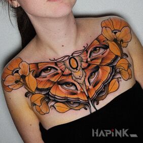 Tattoo Butterfly / Eyes / Flowers on the breast motif: floral style: neo-traditional