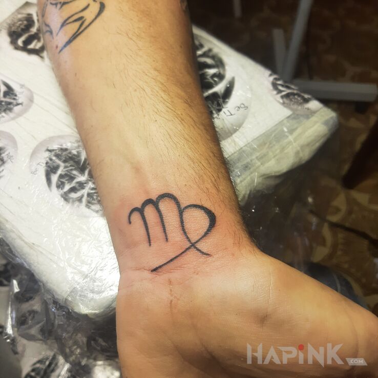 Tattoo Zodiak in zodiac signs motif and minimalistic style on the wrist