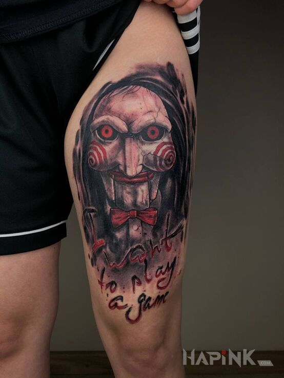 Tattoo I want to play a game in colorful motif and realistic style on the leg