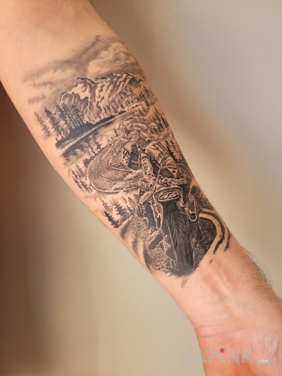 Tattoo Motocykl Góry in nature motif and realistic style on the forearm