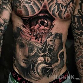 Tattoo Hand coming out of an eye on the stomach motif: dark style: realistic