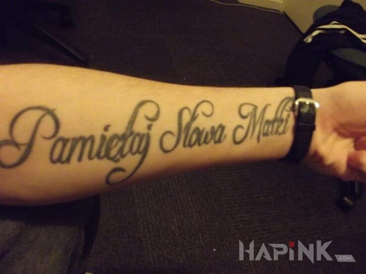 Tattoo Psm pamiętaj słowa matki :) in lettering motif on the forearm