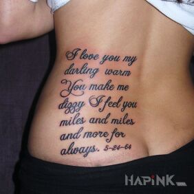 Tattoo Love message on the back motif: lettering style: calligraphy