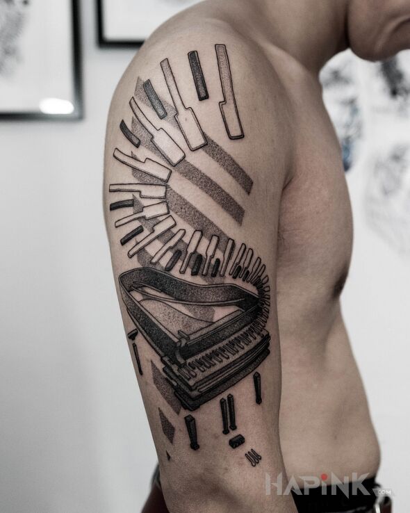 Tattoo Fortepian in objects motif and dotwork style on the upper arm