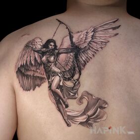 Tattoo Angelica with a bow on the back motif: black and gray style: realistic