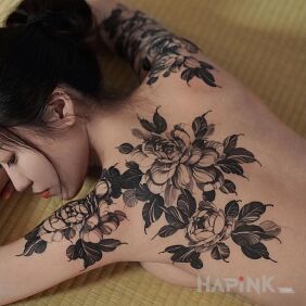 Tattoo Flowers on a Japanese Woman on the back motif: skulls style: realistic