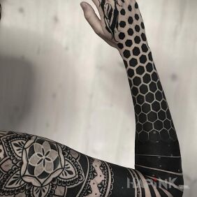 Tattoo Fifty fifty On the arm motif: butterflies style: blackwork / blackout