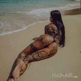 Tattoo Baby on the beach on the thigh motif: faces