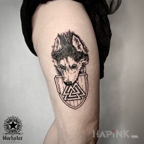 Tattoo Wolf. on the thigh motif: black and gray style: graphic / illustrative