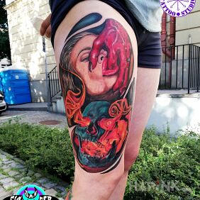 Tattoo Devil's hand on the thigh motif: colorful style: realistic