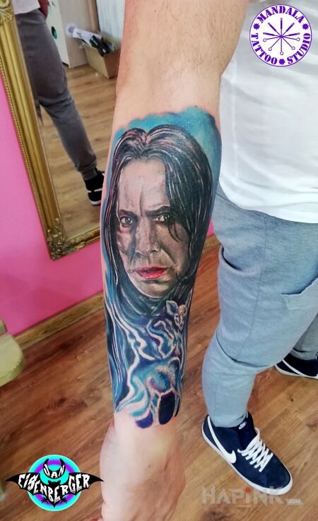 Tattoo Snape in characters motif and realistic style on the forearm