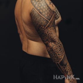 Tattoo Geometric style sleeve on the hand motif: black and gray style: geometric