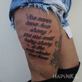Tattoo You never know how strong you are on the thigh motif: lettering style: calligraphy