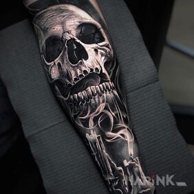 Tattoo Skull in candle smoke On the arm motif: black and gray style: realistic