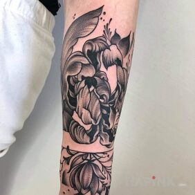 Tattoo Flower On the arm motif: black and gray style: graphic / illustrative