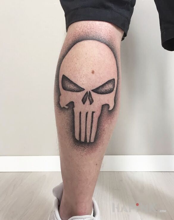 Tattoo Skull in skulls motif and dotwork style on the calf