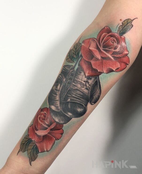 Tattoo Boks in objects motif and realistic style On the arm