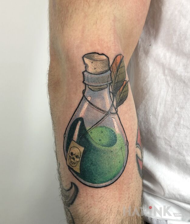 Tattoo Butelka in colorful motif and graphic / illustrative style on the forearm