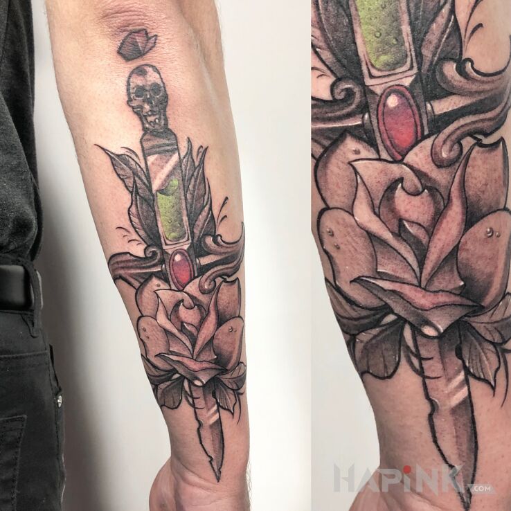 Tattoo Sztylet in black and gray motif and neo-traditional style On the arm