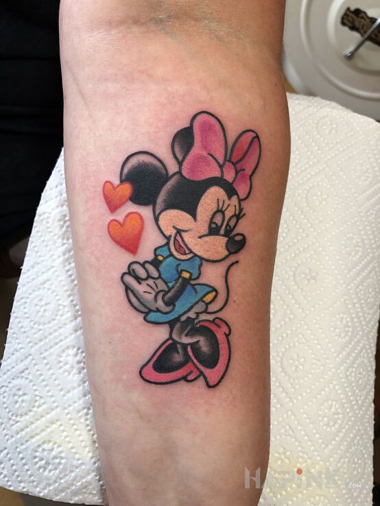Tattoo Minnie Mouse / Disney in colorful motif and cartoon / comic book style On the arm