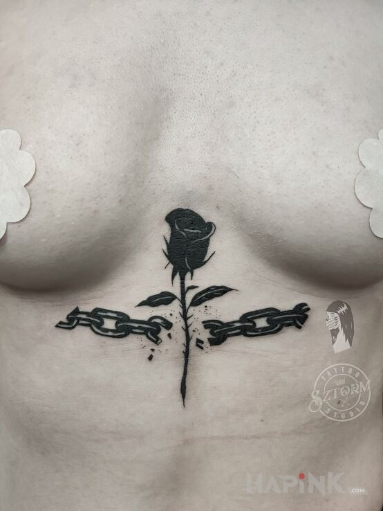 Tattoo Broken chain in flowers motif and blackwork / blackout style underboob