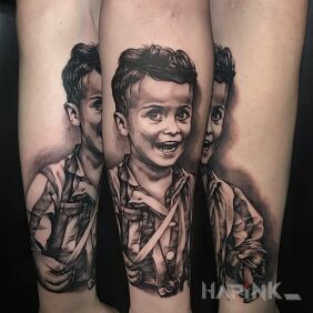 Tattoo Portrait On the arm motif: black and gray style: realistic