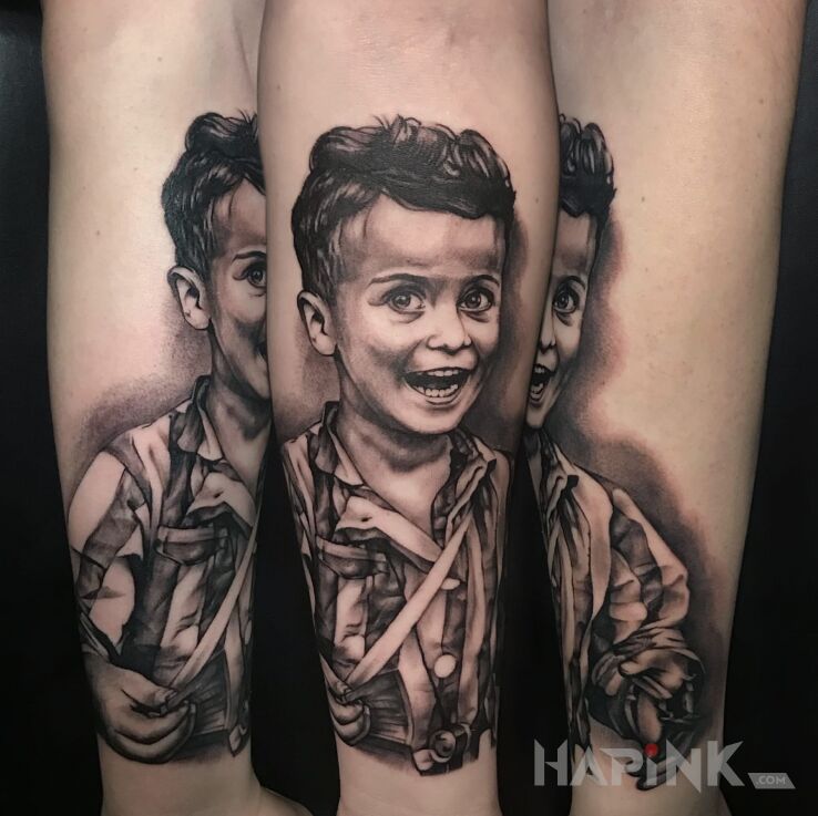 Tattoo Portretowy in black and gray motif and realistic style On the arm
