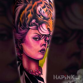 Tattoo Woman with a tiger On the arm motif: colorful style: newschool