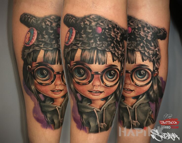 Tattoo Uroczy in colorful motif and realistic style on the forearm