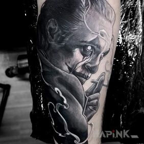 Tattoo Joker On the arm motif: characters style: realistic