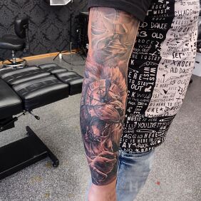 Tattoo Lion on the forearm motif: sleeves style: realistic