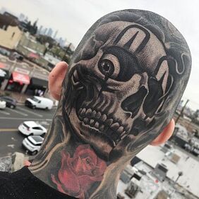 Tattoo Skull on skull on the head motif: black and gray style: realistic