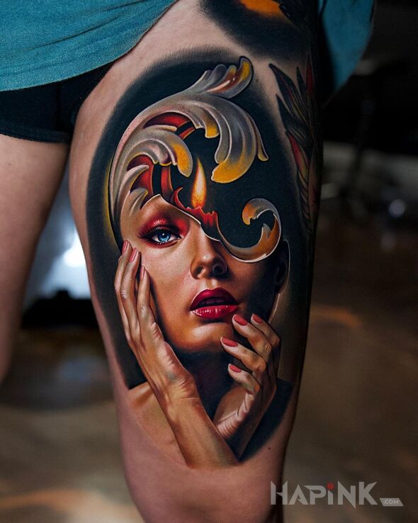 Tattoo Ogień wewnątrz kobiety in faces motif and realistic style on the thigh