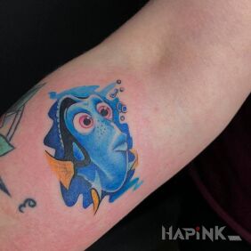 Tattoo Dory the Fish On the arm motif: characters style: cartoon / comic book