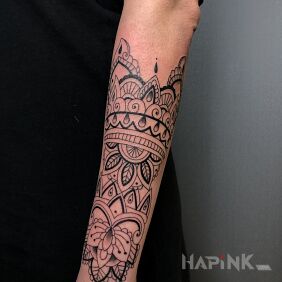 Tattoo Mandala on the arm On the arm motif: black and gray style: contour / linework