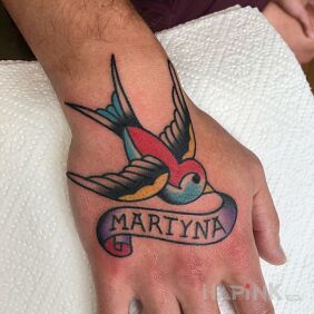 Tattoo Swallow / Ribbon / Sash on the hand motif: colorful style: oldschool