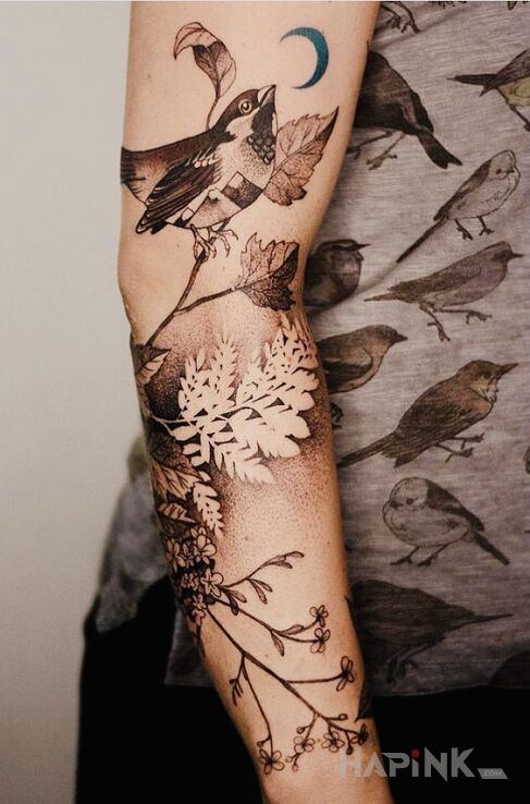 Tattoo Ptaszula in black and gray motif and realistic style On the arm