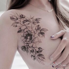 Tattoo Flowers on the side of the boob on the breast motif: floral style: graphic / illustrative