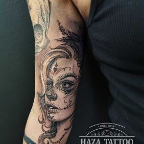 Tattoo Santa muerte On the arm motif: black and gray style: realistic