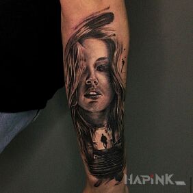 Tattoo Portrait On the arm motif: black and gray style: realistic