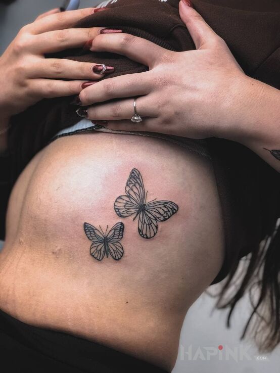 Tattoo Butterfly in butterflies motif and graphic / illustrative style on the ribs