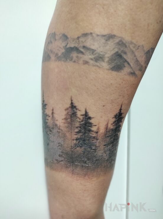 Tattoo Las z Górami in nature motif and graphic / illustrative style on the forearm