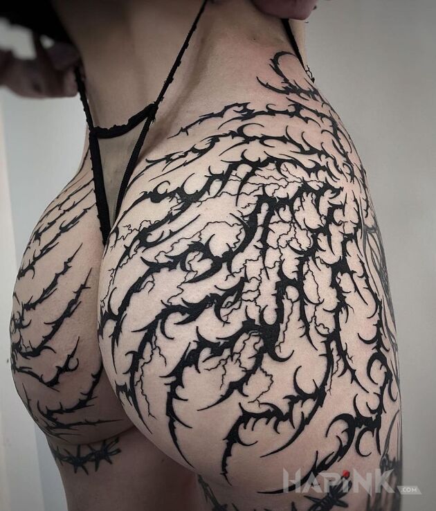 Tattoo Hard in sexy motif and blackwork / blackout style on the buttocks