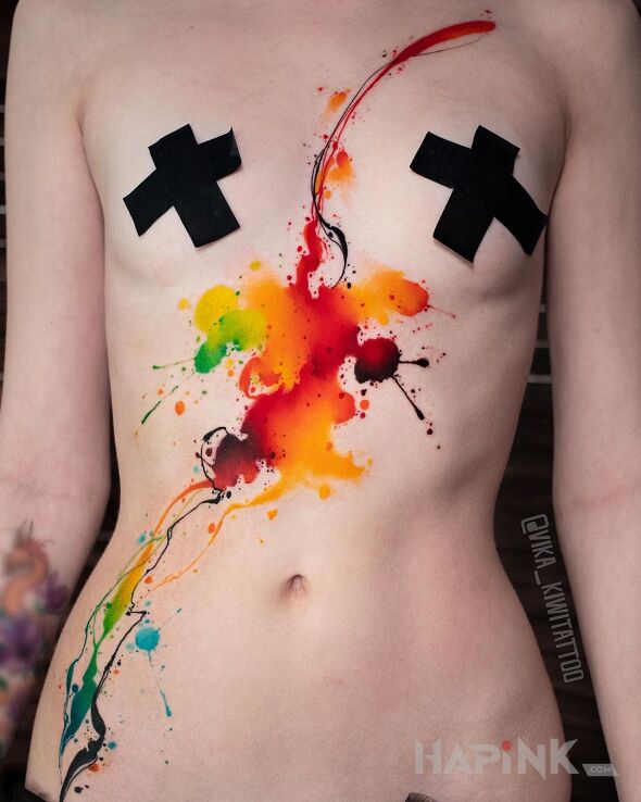 Tattoo Kolorowa plama in other motif and Watercolor style between the breasts