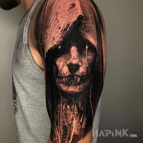 Tattoo Hooded figure on the upper arm motif: dark style: realistic