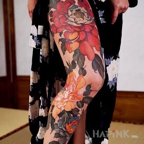 Tattoo Flowers in three colors on the tibia motif: floral style: graphic / illustrative